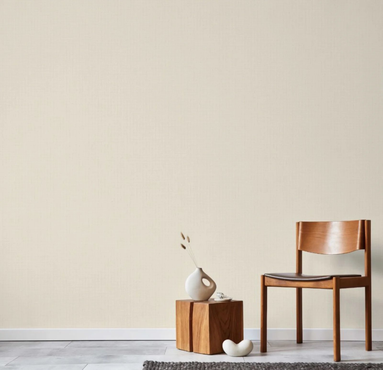 Living room with cream sofa, wooden coffee table, and green textured wall